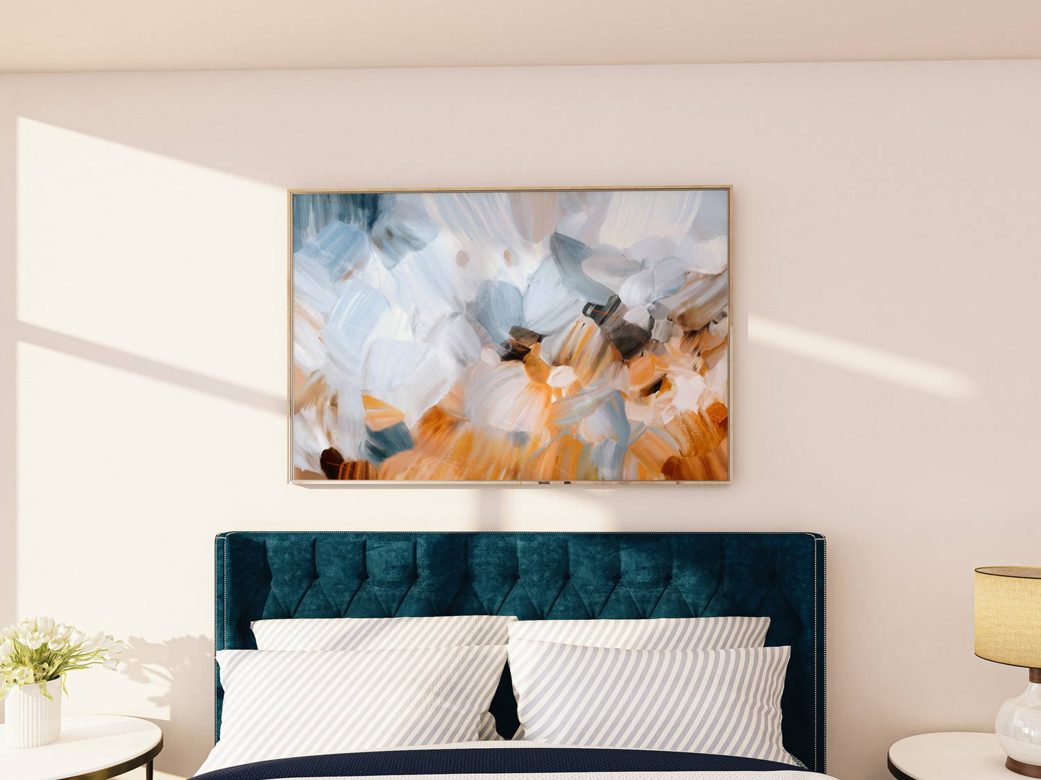 Serene light blue art over a king bed