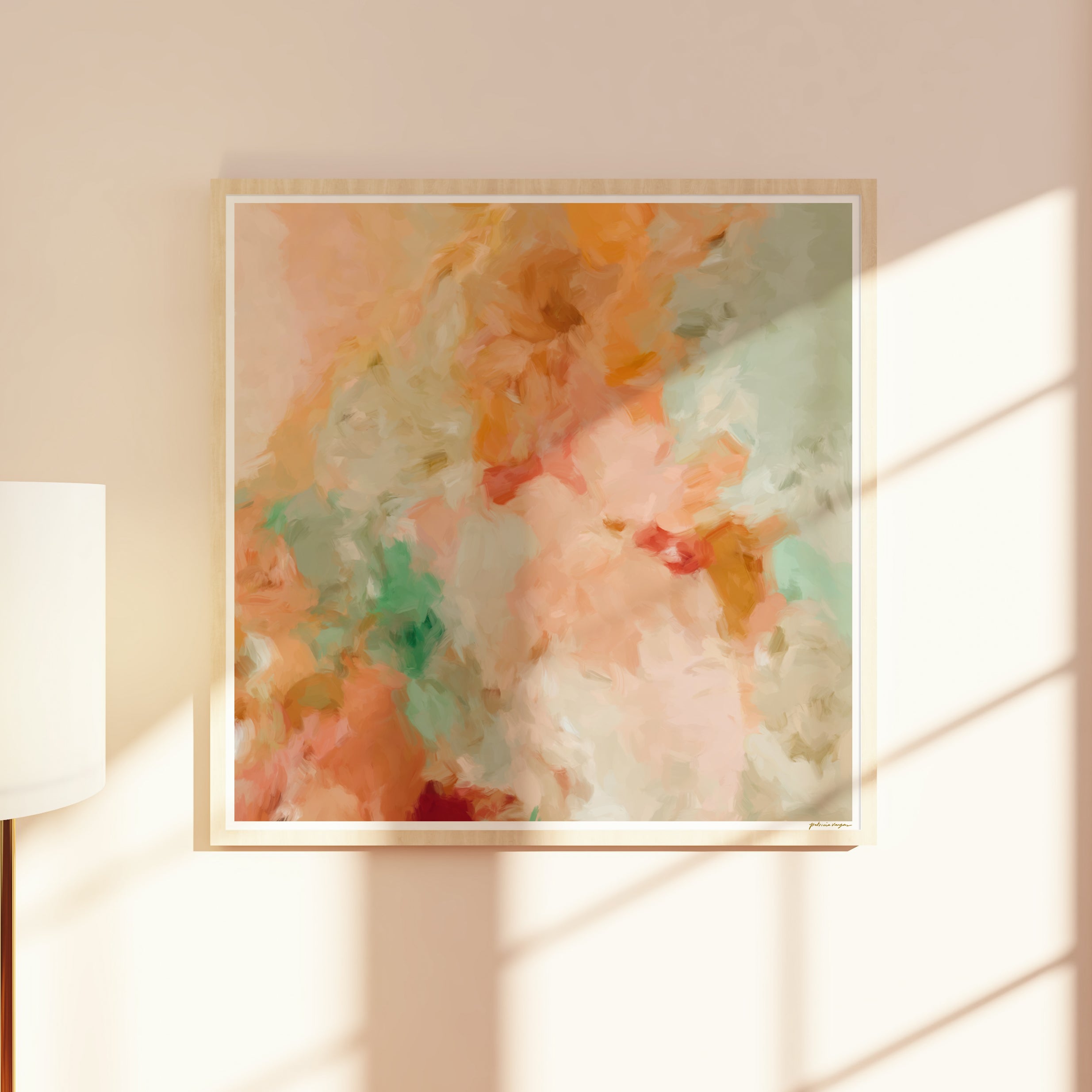 Framed abstract wall art print with soft pastel colors on a wall. Large art for a contemporary home