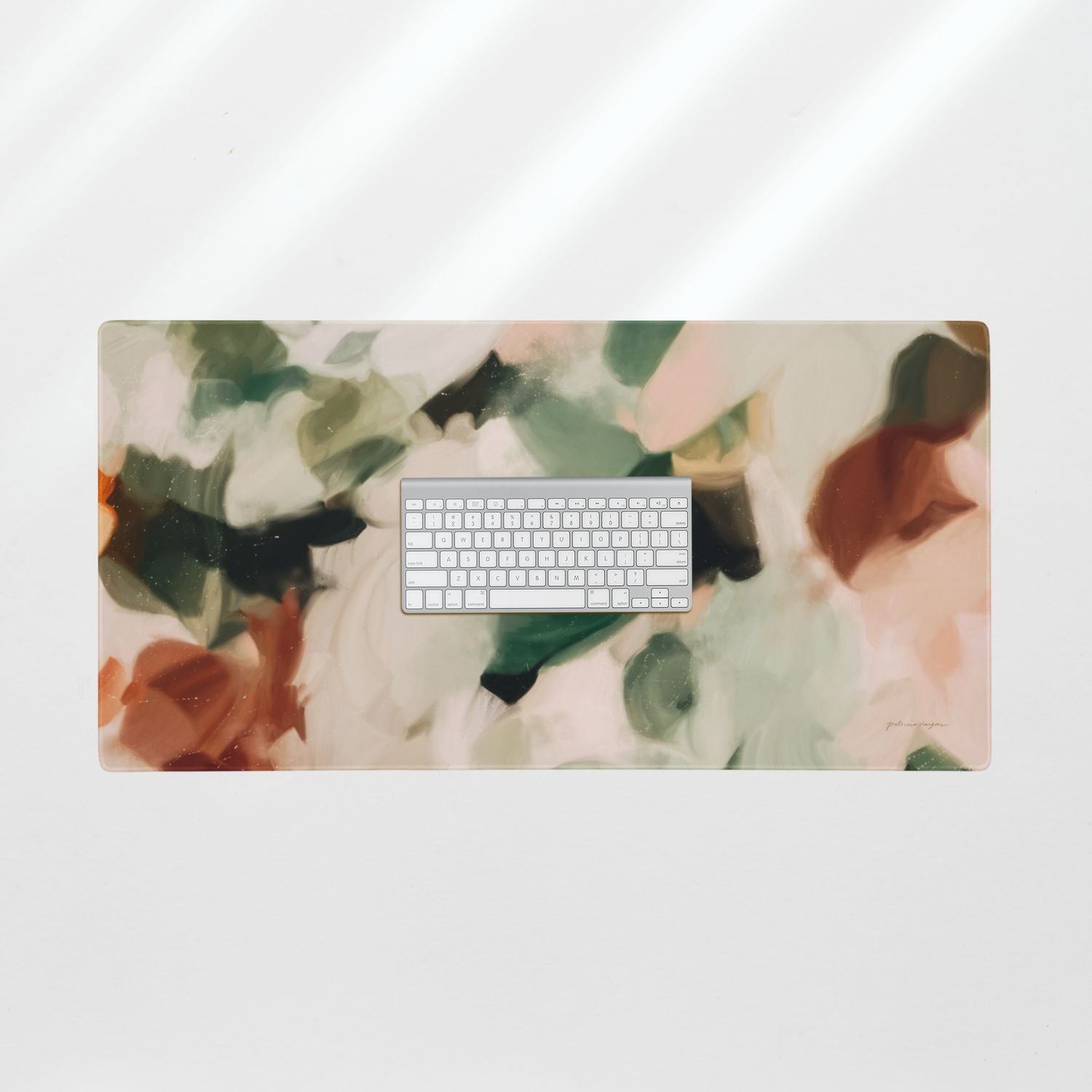 Dionne, green and brown desk mat for styling your office desk. Featuring artwork by Parima Studio. Home office styling accessories, cubicle styling accessories.