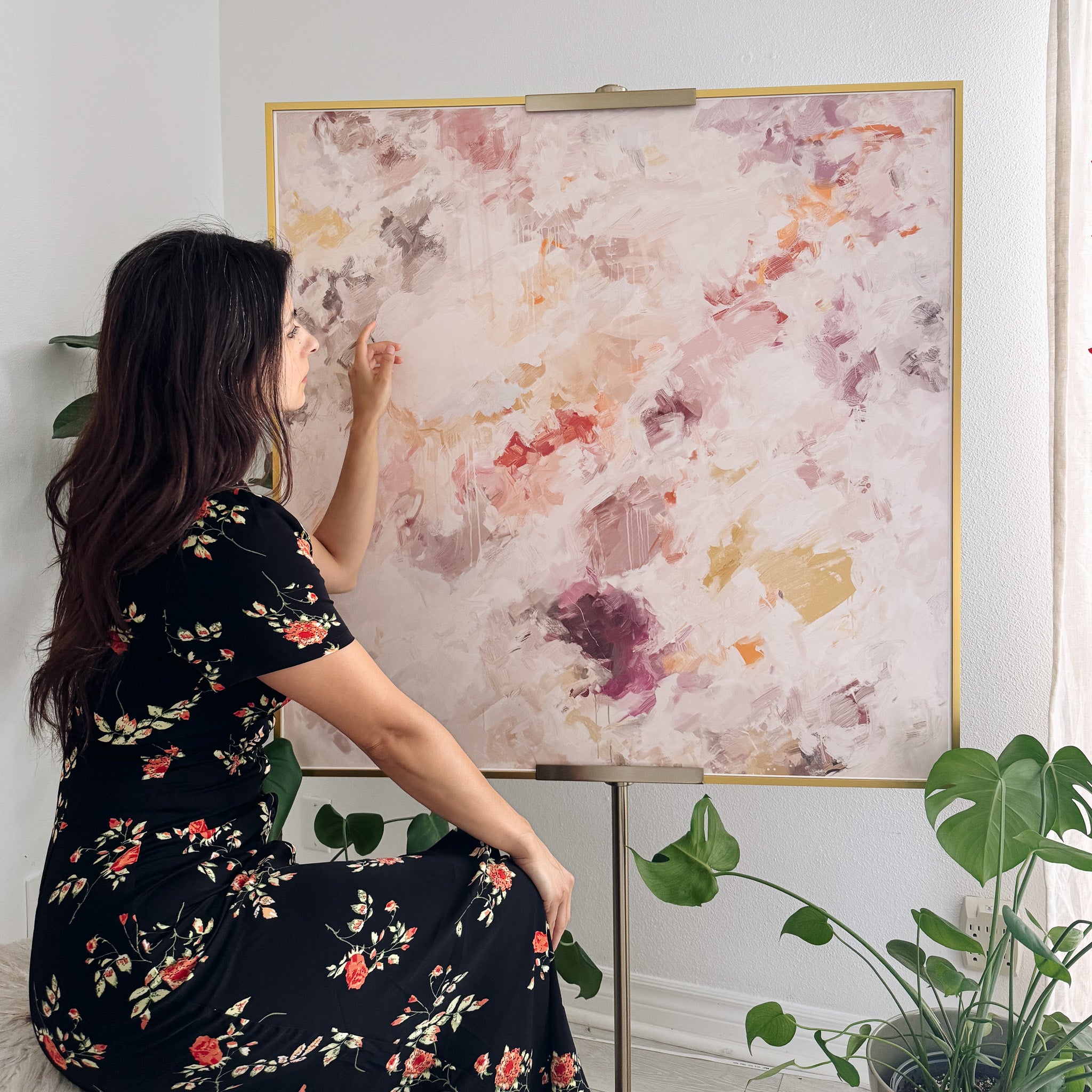 Patricia Vargas in her studio with her abstract art print "With Love" - soft ethereal abstract wall art print by Parma Studio