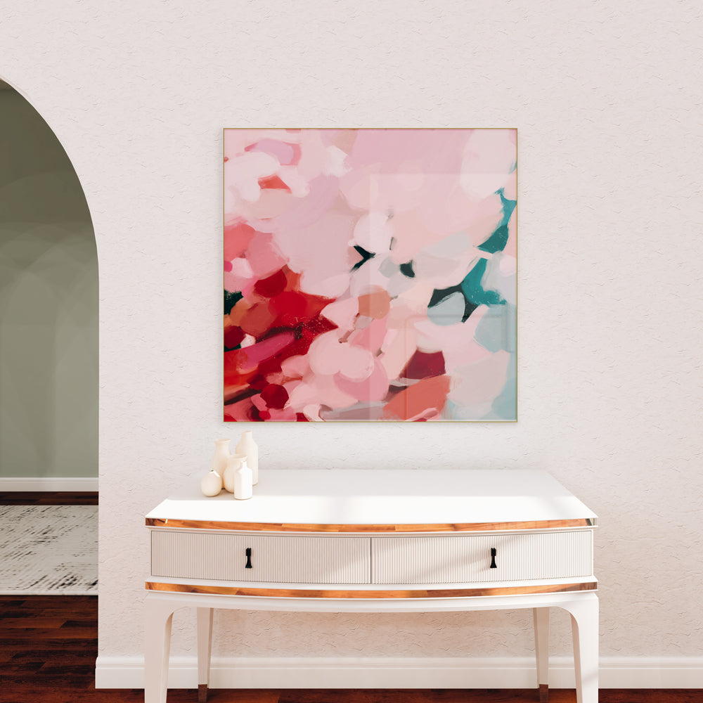 Tulip, square abstract art - pink and teal wall art over console in living room with arch entryway by Parima Studio