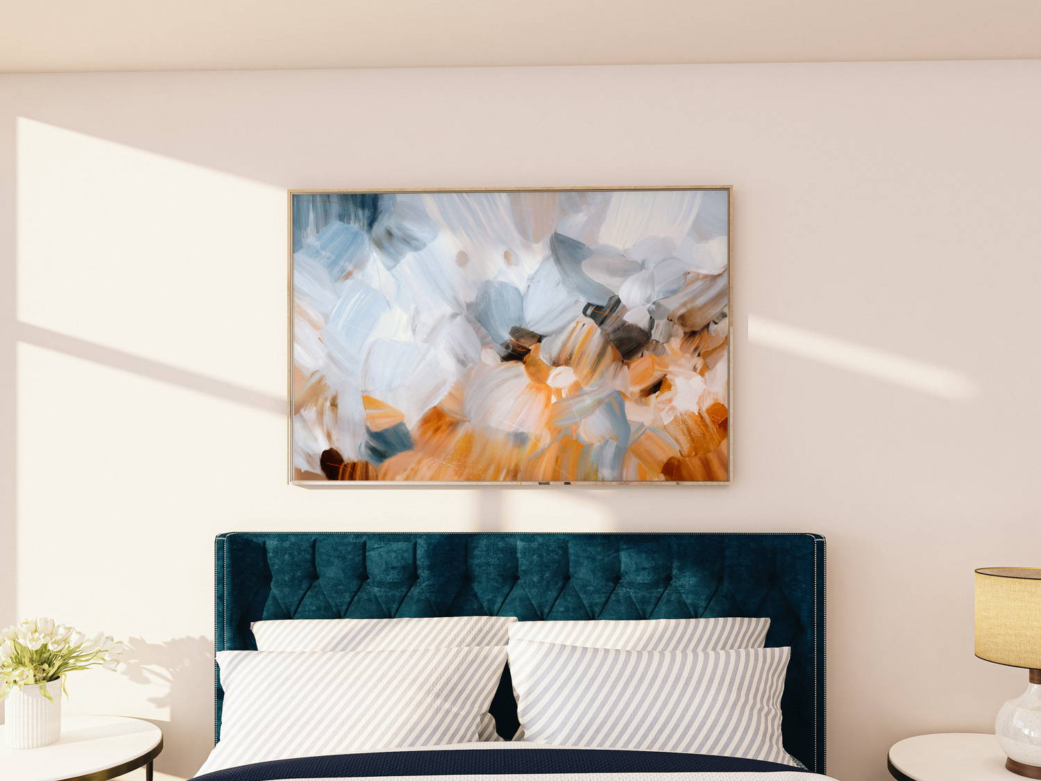 Serene light blue art  over a king bed
