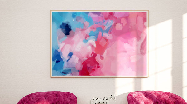 Large pink and blue art for a chic sitting area