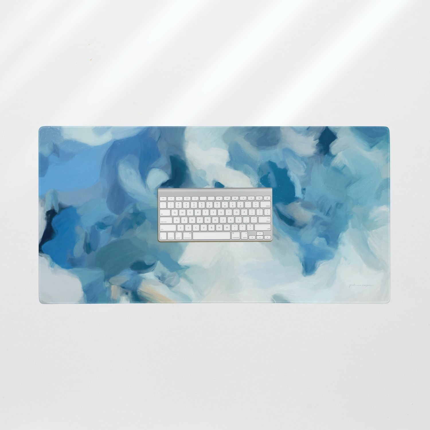 Liviana, blue desk pad for styling your office desk. Featuring artwork by Parima Studio. Home office styling accessories, cubicle styling accessories.