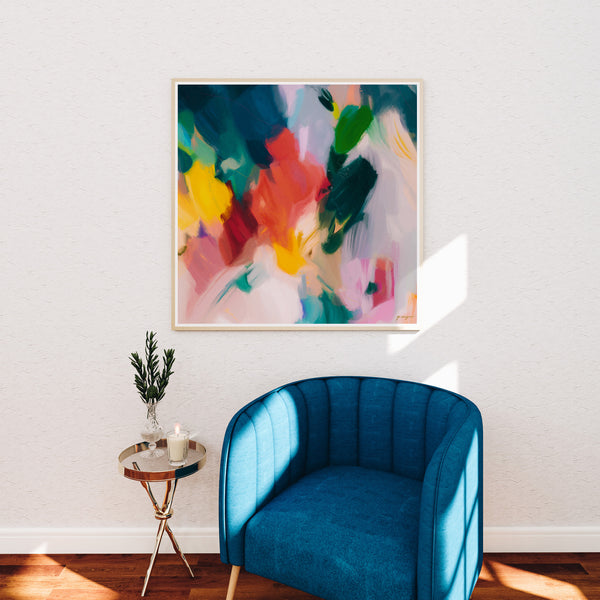 Pomme, colorful abstract wall art print - square art over blue accent chair in living room decor by Parima Studio